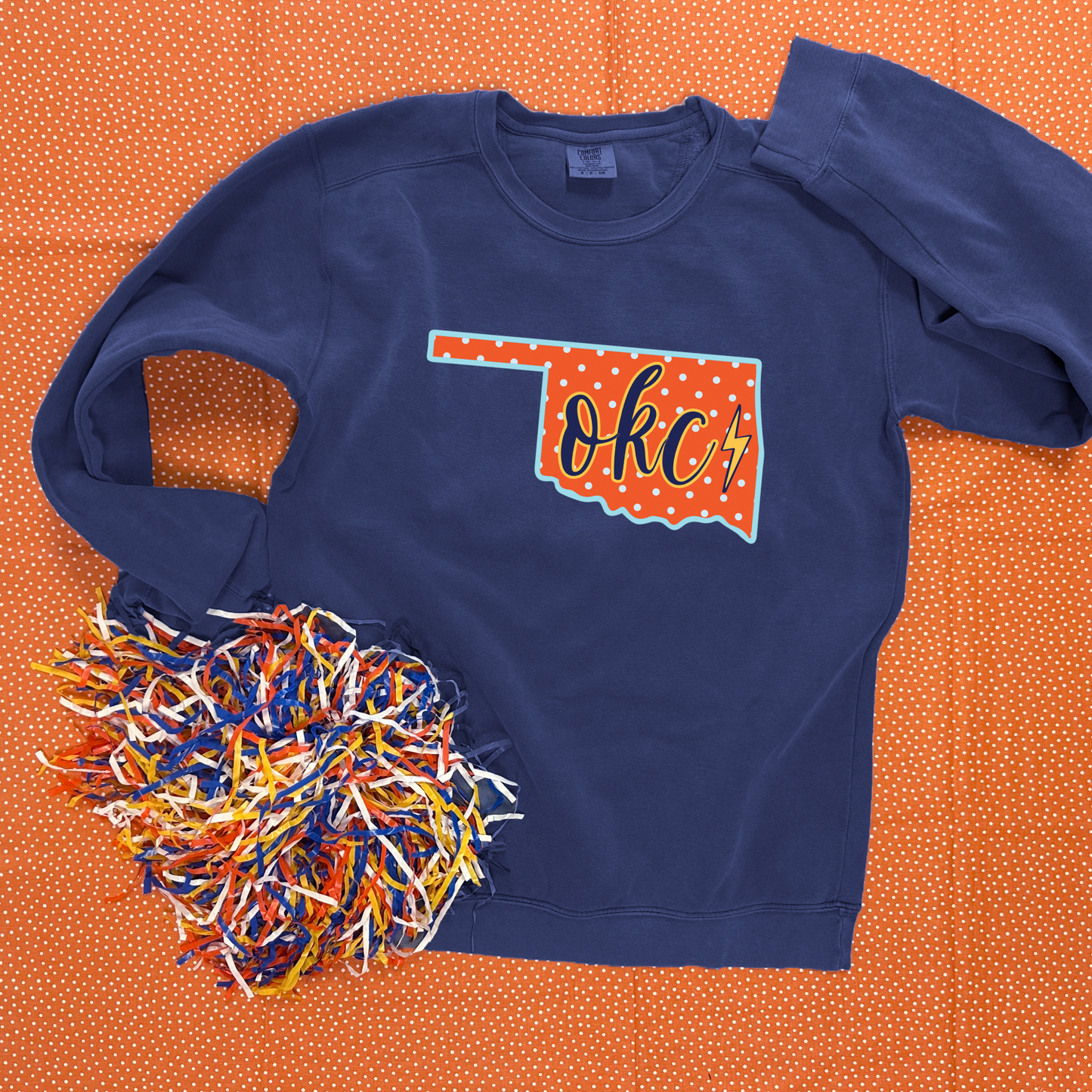 OKC SPIRIT 2025: Oklahoma State Shape "OKC" Script (COMFORT COLORS SWEATSHIRT)